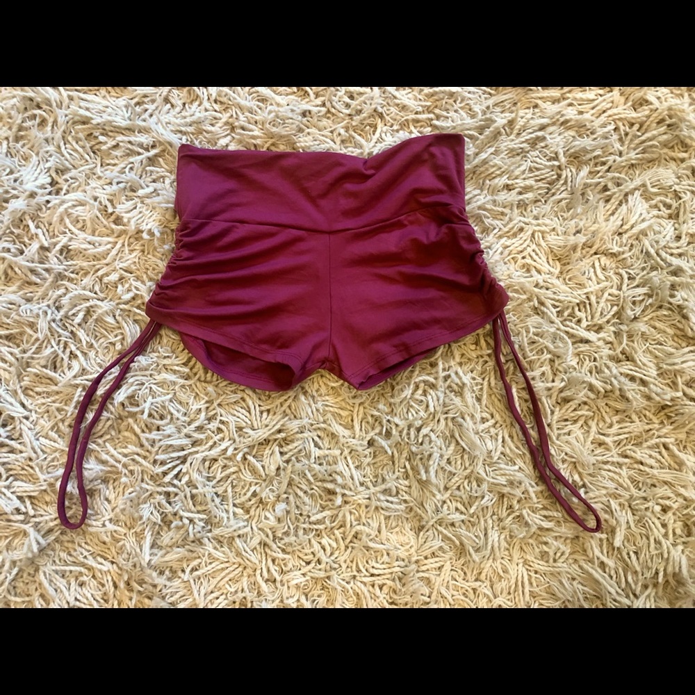 Never worn yoga shorts. Rich color and fabric. Cinched sides.